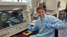 Enthusiastic intern sitting in front of diebonder