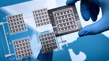 CITC researcher holding samples of a new chip packaging concept